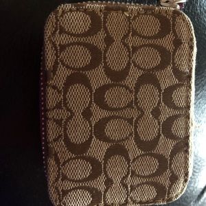 Coach pill organizer with containers